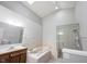 Bright bathroom featuring a soaking tub and a separate glass-enclosed shower at 9303 Aintree Dr, Indianapolis, IN 46250