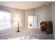 Bedroom boasting neutral walls, plush carpeting, a large window, and a vintage desk at 9303 Aintree Dr, Indianapolis, IN 46250