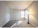Bright bedroom featuring neutral walls, plush carpeting, and natural light from a large window at 9303 Aintree Dr, Indianapolis, IN 46250