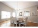 Bright dining area with wood floors, chandelier, and access to other rooms in the house at 9303 Aintree Dr, Indianapolis, IN 46250
