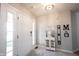 Bright entryway with tile flooring and front door sidelights, complemented by stylish decorations at 9303 Aintree Dr, Indianapolis, IN 46250