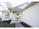 Inviting front entrance with decorative wreath and covered porch, enhancing curb appeal of the home at 9303 Aintree Dr, Indianapolis, IN 46250