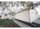 Well-maintained home with white siding, attached garage, and a tidy walkway leading to the front entrance at 9303 Aintree Dr, Indianapolis, IN 46250