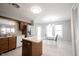 Functional kitchen with island, stainless steel refrigerator, and adjacent eating area at 9303 Aintree Dr, Indianapolis, IN 46250