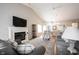 Inviting living room with a fireplace, hardwood floors, and comfortable sofas at 9303 Aintree Dr, Indianapolis, IN 46250