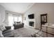 Bright living room featuring a fireplace, comfortable seating, and lots of natural light at 9303 Aintree Dr, Indianapolis, IN 46250