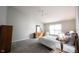 Main bedroom boasts high ceilings, plush carpets, neutral walls and many windows at 9303 Aintree Dr, Indianapolis, IN 46250