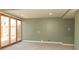 Large carpeted basement featuring sliding glass doors for natural light at 953 S 5Th St, Noblesville, IN 46060