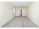 Spacious bedroom with neutral walls, plush carpeting, and a closet for storage at 953 S 5Th St, Noblesville, IN 46060