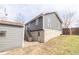 Home exterior featuring stone foundation, detached garage and stairs at 953 S 5Th St, Noblesville, IN 46060