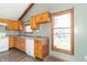 Functional kitchen featuring wood cabinets, laminate countertops, and white appliances, providing a practical space at 953 S 5Th St, Noblesville, IN 46060