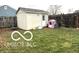 Backyard shed, enclosed by a tall wooden fence and featuring a grassy outdoor space at 1001 Maple W Dr, Lebanon, IN 46052