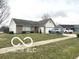 Well-maintained single-story home with a two-car garage and tidy front lawn and driveway at 1001 Maple W Dr, Lebanon, IN 46052