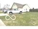 This single-story home features a neatly kept lawn and a long driveway at 1001 Maple W Dr, Lebanon, IN 46052