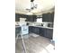 Well-lit kitchen featuring modern appliances, sleek cabinetry, and wood flooring for a contemporary look at 1001 Maple W Dr, Lebanon, IN 46052