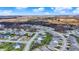 Expansive aerial view of a neighborhood with beautiful homes, lush greenery, and mature trees at 11072 Song Creek Ct, Fishers, IN 46040
