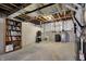 Unfinished basement with water heater, bookcase, and open ceiling at 11072 Song Creek Ct, Fishers, IN 46040