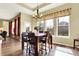 Elegant dining room featuring a large window, chandelier, and a dining table with six chairs at 11072 Song Creek Ct, Fishers, IN 46040