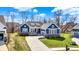 Beautiful blue single-Gathering home with a well-kept lawn, long driveway, and attached garage on a sunny day at 11072 Song Creek Ct, Fishers, IN 46040