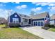 Blue single-Gathering home with attached three car garage, well-maintained lawn, and inviting curb appeal at 11072 Song Creek Ct, Fishers, IN 46040