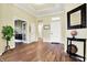 Inviting foyer with hardwood floors, neutral paint, and a view into the adjacent office at 11072 Song Creek Ct, Fishers, IN 46040