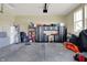 Organized garage with cabinets, work bench, and ample space for storage and hobbies at 11072 Song Creek Ct, Fishers, IN 46040