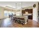 Bright kitchen with granite countertops, an island, and an adjacent dining area at 11072 Song Creek Ct, Fishers, IN 46040