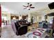 Spacious living room featuring hardwood floors, comfortable seating, and an open layout at 11072 Song Creek Ct, Fishers, IN 46040