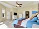 Bright main bedroom features neutral carpet, tray ceiling, and convenient access to an ensuite bathroom at 11072 Song Creek Ct, Fishers, IN 46040