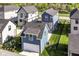 Aerial view of a home with green yard, driveway and modern exterior at 11505 Langton Walk, Zionsville, IN 46077