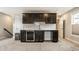 Basement bar with cabinetry, sink and beverage fridge for entertaining guests at 11505 Langton Walk, Zionsville, IN 46077