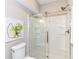 Modern bathroom showcasing a sleek glass-enclosed shower and neutral-toned walls at 11505 Langton Walk, Zionsville, IN 46077