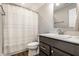 Bathroom featuring a vanity with sink, toilet, and shower with a curtain at 11505 Langton Walk, Zionsville, IN 46077