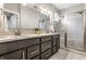 Bathroom featuring dual sinks, decorative lighting, and glass shower at 11505 Langton Walk, Zionsville, IN 46077