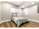 Basement bedroom with egress window and vinyl flooring at 11505 Langton Walk, Zionsville, IN 46077