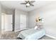 Comfortable bedroom with a twin bed, neutral colors, and ceiling fan at 11505 Langton Walk, Zionsville, IN 46077