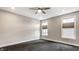 Empty bedroom with gray carpet, large window, and recessed lighting at 11505 Langton Walk, Zionsville, IN 46077