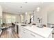 Spacious kitchen with white cabinets, quartz countertops, and stainless steel appliances at 11505 Langton Walk, Zionsville, IN 46077