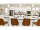 Bright kitchen features a large island with counter seating and modern appliances at 11505 Langton Walk, Zionsville, IN 46077