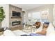 Comfortable living room with a fireplace and a cozy seating arrangement with lots of light at 11505 Langton Walk, Zionsville, IN 46077