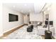 Spacious living room featuring a large sectional couch, black accent tables, and a large television at 11505 Langton Walk, Zionsville, IN 46077