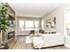 Bright living room featuring a modern fireplace, hardwood floors, and lots of natural light at 11505 Langton Walk, Zionsville, IN 46077