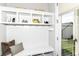 Bright mudroom with white cabinetry, storage cubbies, and convenient access to the outdoors at 11505 Langton Walk, Zionsville, IN 46077