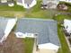 Aerial shot of a single-Gathering home showcasing well-maintained roof and surrounding landscape at 1156 E Mill Run Blvd, Greenfield, IN 46140