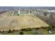 Extensive view of large empty land and several homes, showing residential area and agricultural fields at 1156 E Mill Run Blvd, Greenfield, IN 46140