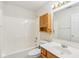 Bright bathroom featuring a shower/tub combo, toilet, and wood vanity with a mirror at 1156 E Mill Run Blvd, Greenfield, IN 46140