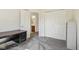 Bedroom featuring neutral walls, carpet, closet, and a bathroom with a wooden vanity at 1156 E Mill Run Blvd, Greenfield, IN 46140