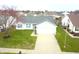 Charming single-Gathering home features an attached two car garage and large front yard at 1156 E Mill Run Blvd, Greenfield, IN 46140