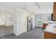 Bright kitchen with stainless steel refrigerator and an open doorway leading to another room at 1156 E Mill Run Blvd, Greenfield, IN 46140