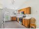 Traditional kitchen boasts wooden cabinets, stainless steel appliances, and ample counter space at 1156 E Mill Run Blvd, Greenfield, IN 46140